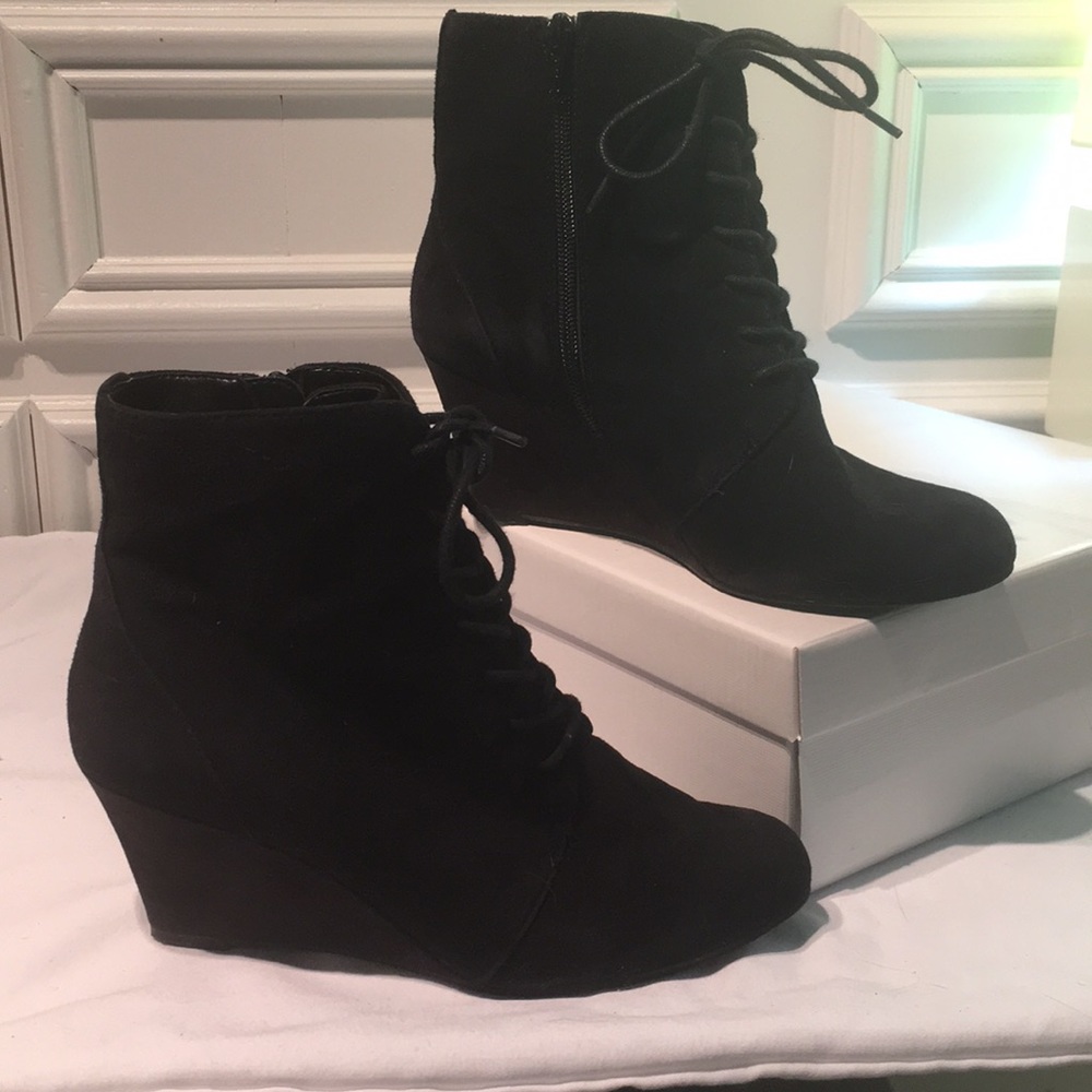 Black lace up boots with a side zipper